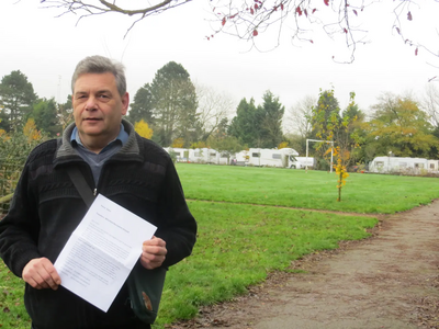 Travellers occupy Whinfield Recreation Ground - Cllr Neil Sandison in the foreground