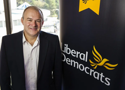 Ed Davey with Banner