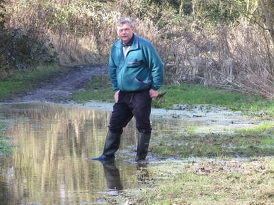 Cllr Neil Sandison standing in a puddle in Great Central Way 6 March 2015